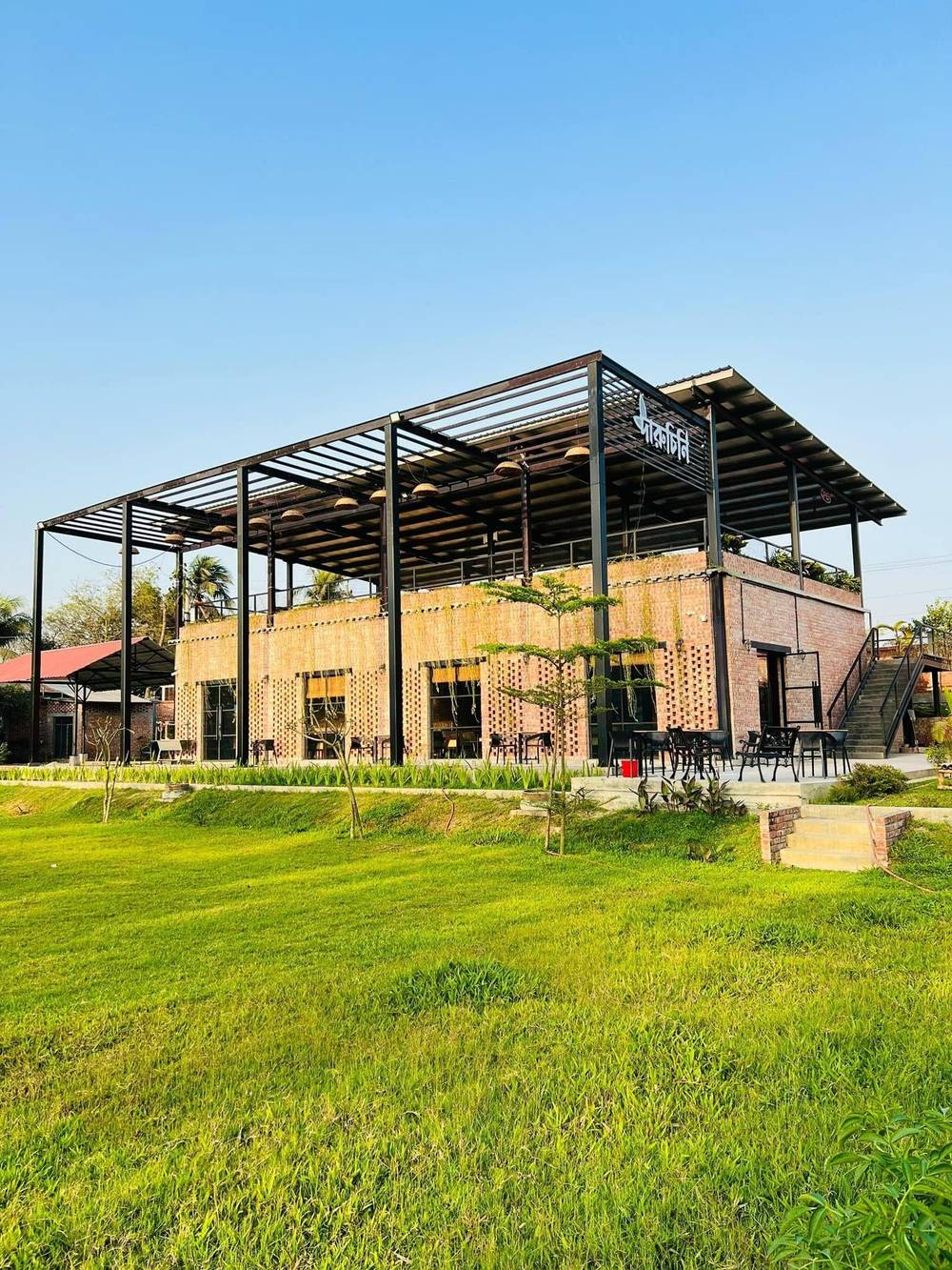 Daylight view of Daruchini Restaurant's brick jali facade