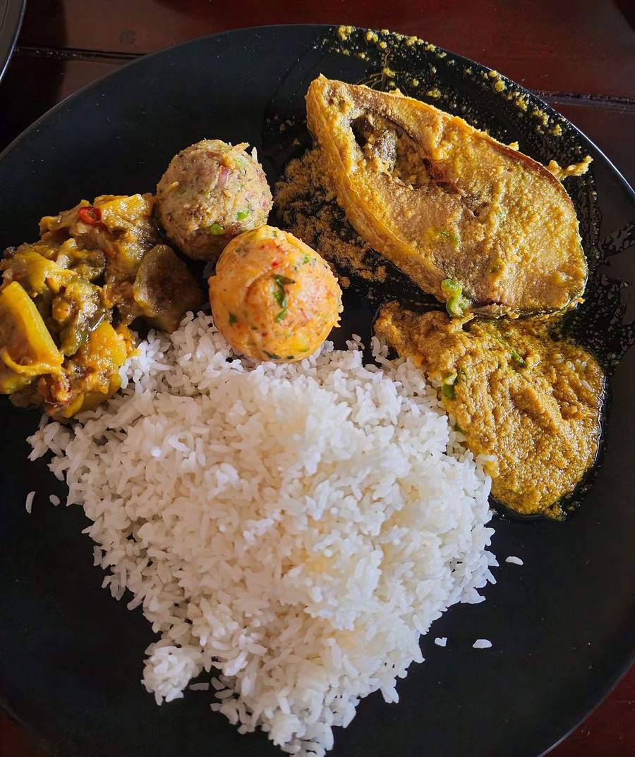Overhead view of a fish curry and rice thali